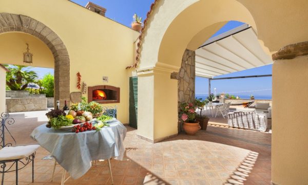 Outdoor dining at Villa Ferrara